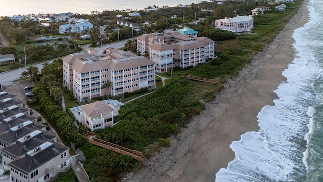 aerial view featuring a view of the beach and a water view