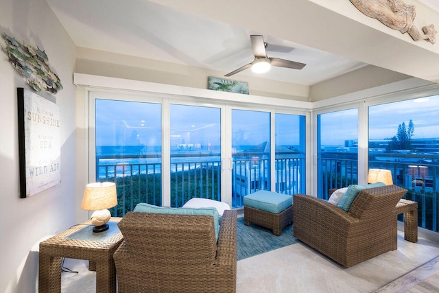 sunroom featuring ceiling fan