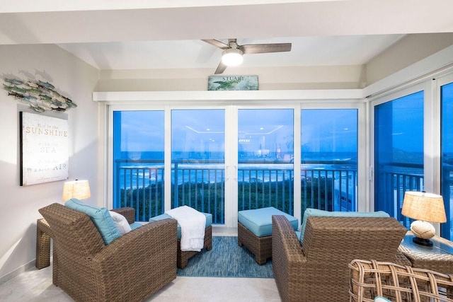 sunroom featuring ceiling fan