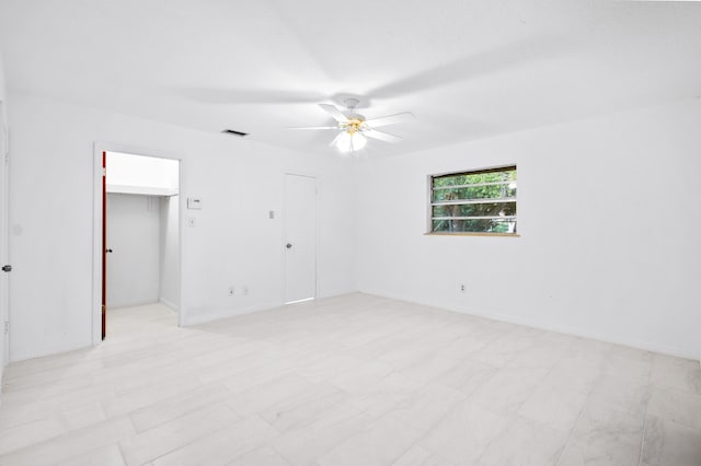 empty room featuring ceiling fan