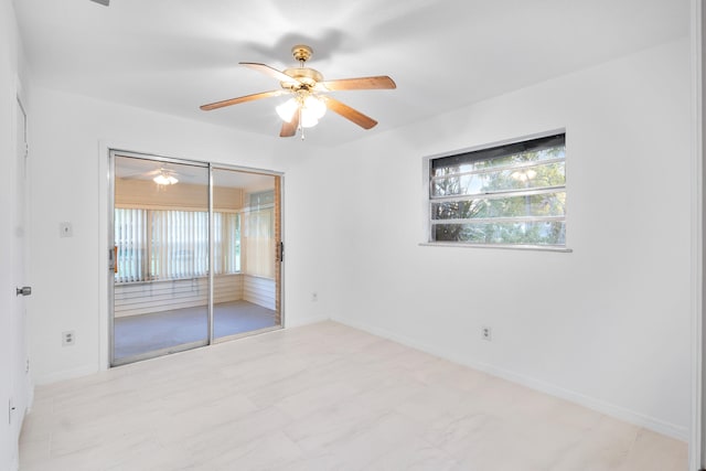 empty room featuring ceiling fan