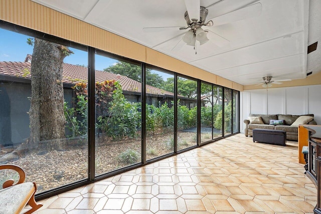 sunroom / solarium featuring ceiling fan