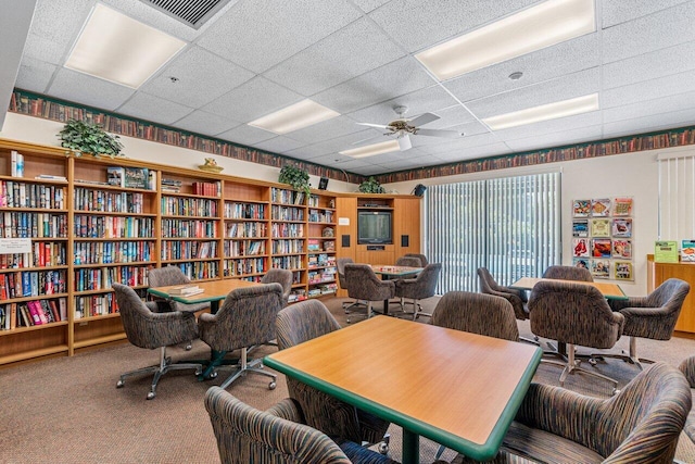 office with carpet, a paneled ceiling, and ceiling fan