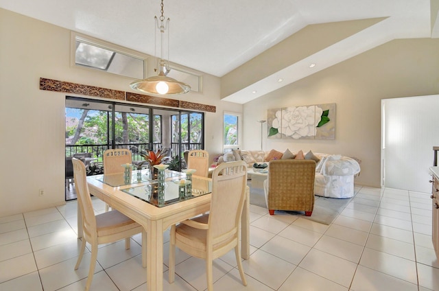 tiled dining area with lofted ceiling