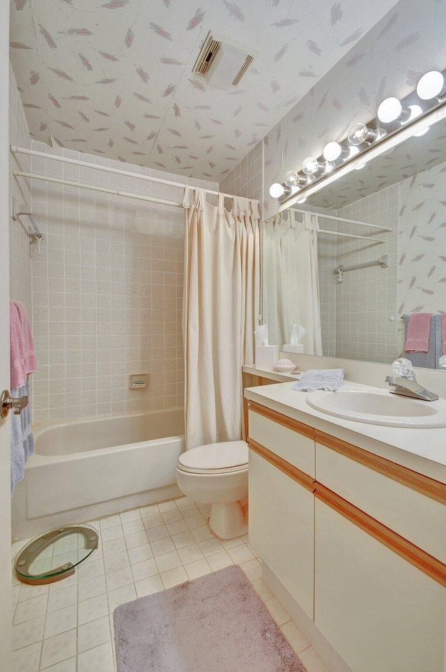 full bathroom with toilet, vanity, shower / bath combination with curtain, and tile patterned flooring