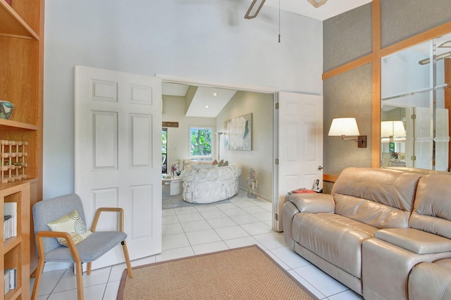 living room featuring high vaulted ceiling, light tile patterned floors, and ceiling fan