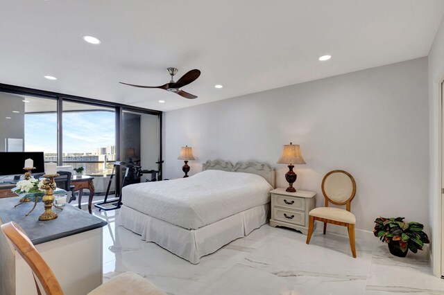 bedroom with access to outside, a wall of windows, and ceiling fan