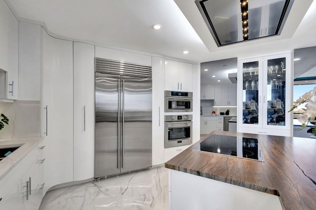 kitchen with stainless steel appliances and white cabinets