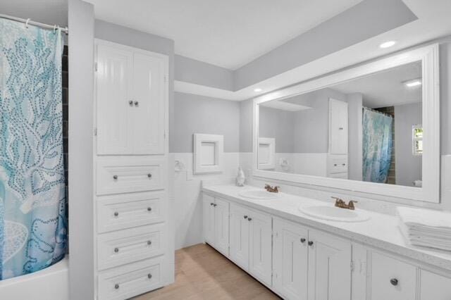 bathroom with vanity and shower / tub combo