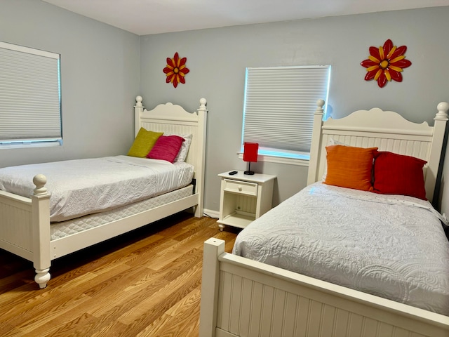 bedroom with light hardwood / wood-style floors