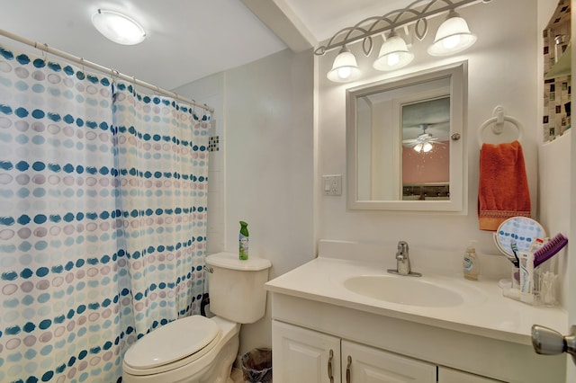 bathroom with vanity, ceiling fan, toilet, and a shower with shower curtain