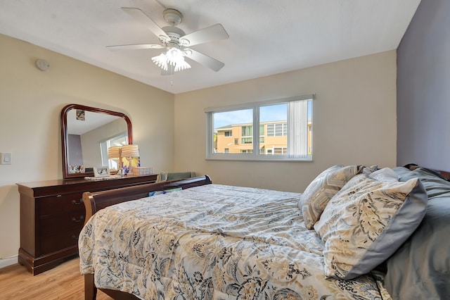 bedroom featuring light hardwood / wood-style floors and ceiling fan