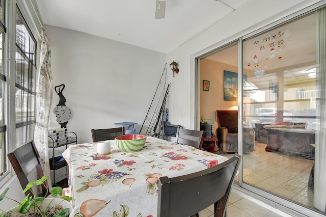 dining room featuring ceiling fan and light tile patterned floors