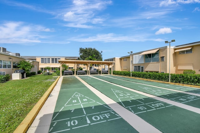 view of community featuring a lawn