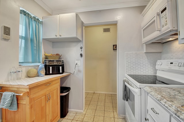 kitchen featuring ornamental molding, light tile patterned floors, backsplash, white appliances, and white cabinets