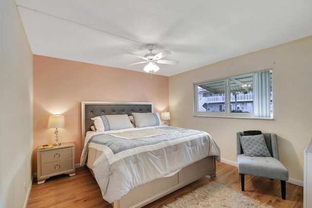 bedroom featuring hardwood / wood-style flooring and ceiling fan