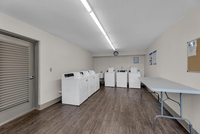 9 Royal Palm Way Unit 4020, Boca Raton, FL 33432 - community laundry with washing machine and dryer, dark wood finished floors, a textured ceiling, and baseboards
