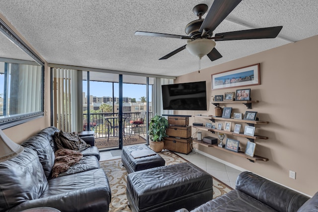 living room featuring floor to ceiling windows, a textured ceiling, light tile patterned floors, and ceiling fan