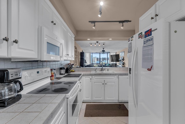 9 Royal Palm Way Unit 4020, Boca Raton, FL 33432 - kitchen with white appliances, a sink, tile countertops, and white cabinetry