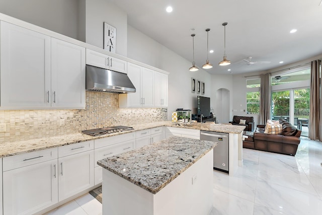 kitchen with kitchen peninsula, white cabinetry, hanging light fixtures, and appliances with stainless steel finishes