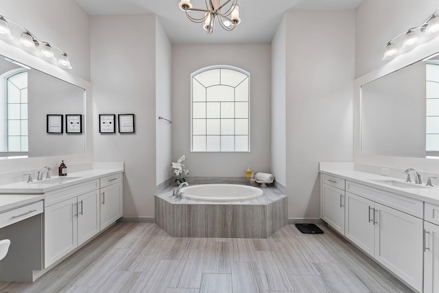 bathroom with hardwood / wood-style flooring, vanity, and a wealth of natural light