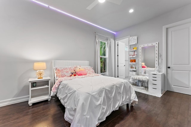 bedroom featuring ceiling fan and dark hardwood / wood-style floors