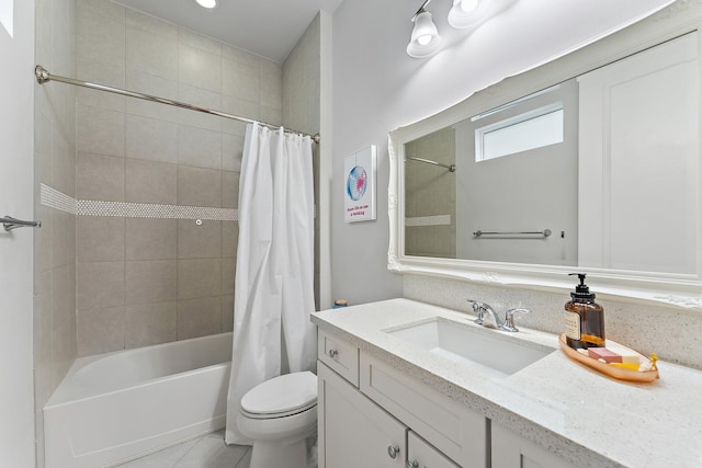 full bathroom featuring tile patterned floors, shower / tub combo with curtain, vanity, and toilet