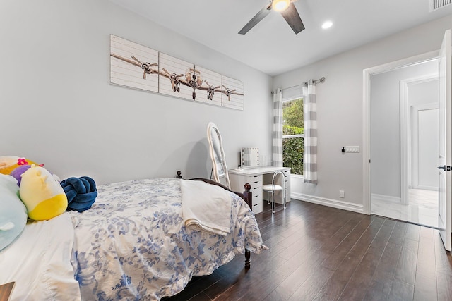 bedroom featuring ceiling fan and dark wood-type flooring