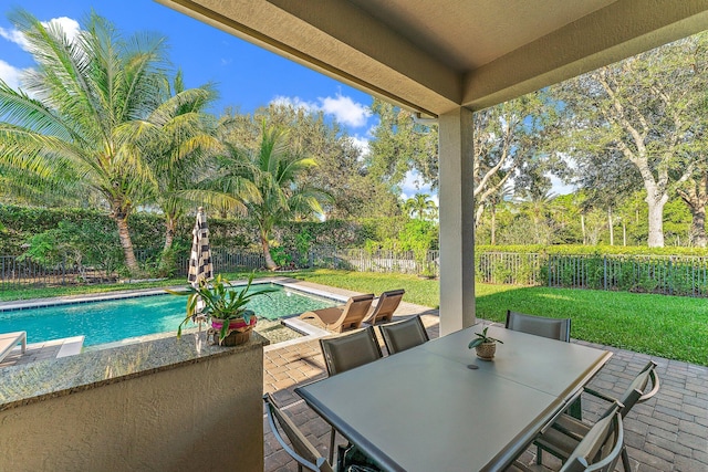 view of patio with a fenced in pool