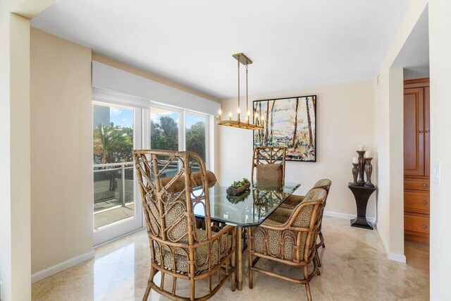 dining space featuring an inviting chandelier