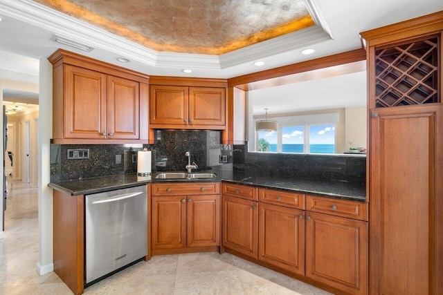 kitchen featuring ornamental molding, a raised ceiling, sink, dishwasher, and a water view