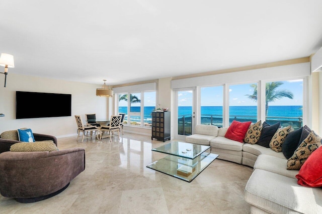 unfurnished dining area featuring a tray ceiling, elevator, and light hardwood / wood-style flooring