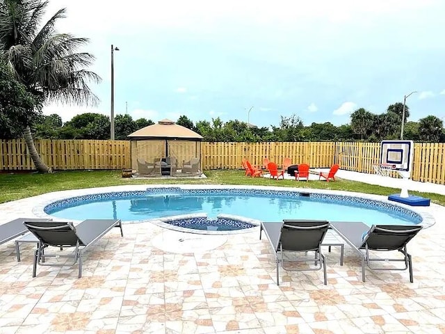 view of pool featuring a patio and a gazebo