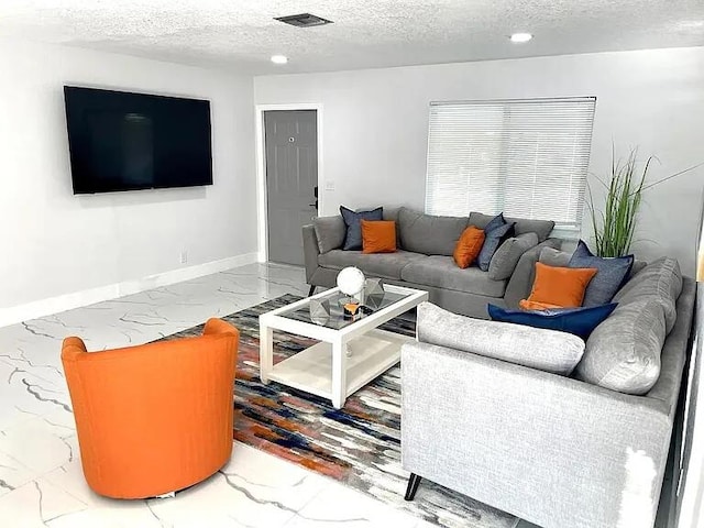 living room with a textured ceiling