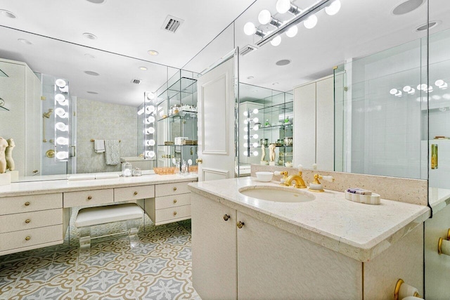 bathroom featuring walk in shower and vanity