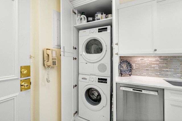 washroom with stacked washer / drying machine