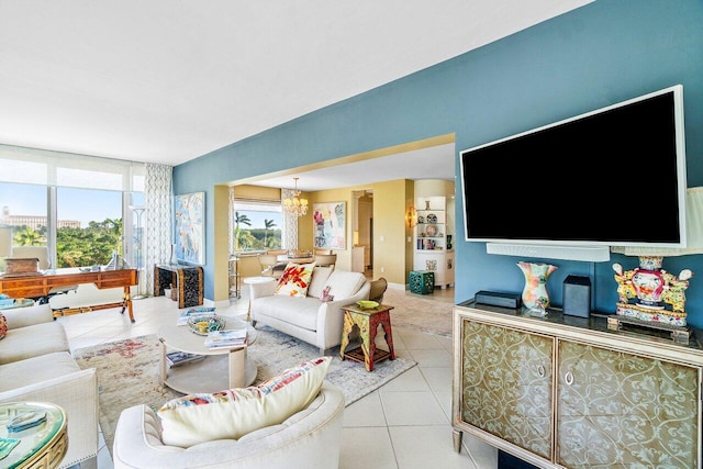 tiled living room with a chandelier