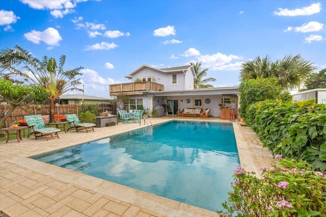 view of swimming pool with a patio