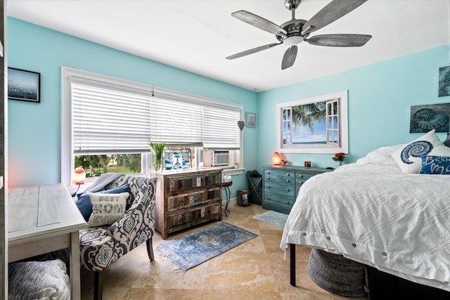 bedroom with ceiling fan and cooling unit