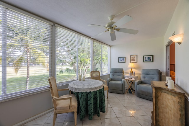 sunroom featuring ceiling fan