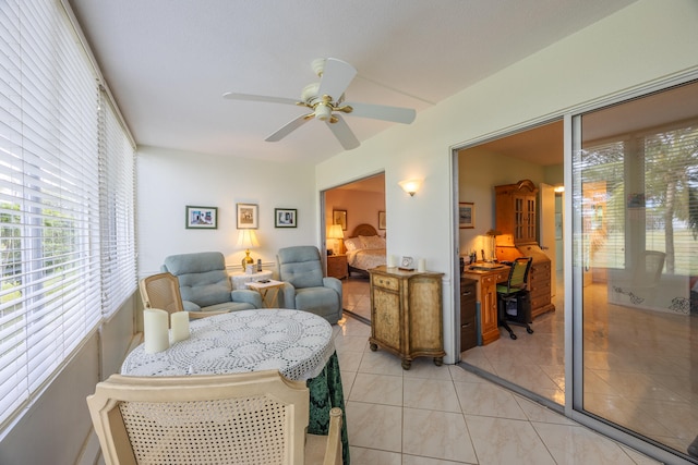 sitting room featuring ceiling fan and light tile patterned flooring