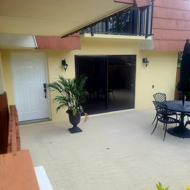 view of patio / terrace with a balcony