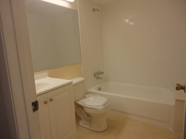 full bathroom with toilet, vanity, tile patterned floors, and  shower combination