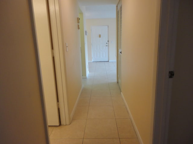 hallway with light tile patterned floors