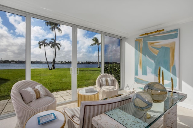 sunroom / solarium with a water view