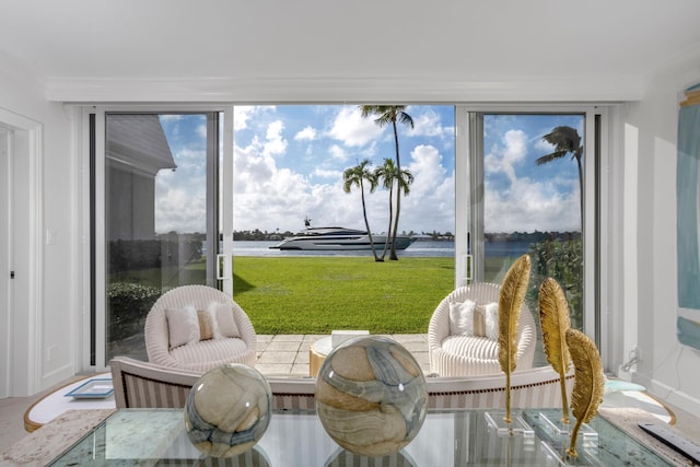 sunroom featuring a water view and plenty of natural light