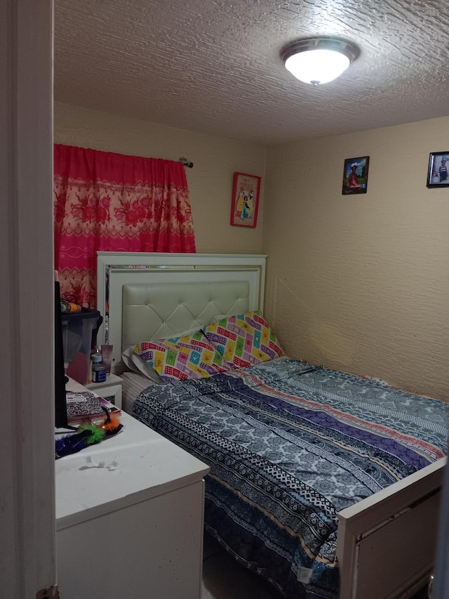 bedroom featuring a textured ceiling