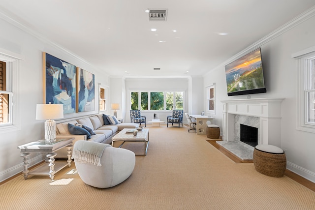 living room featuring carpet, ornamental molding, and a fireplace