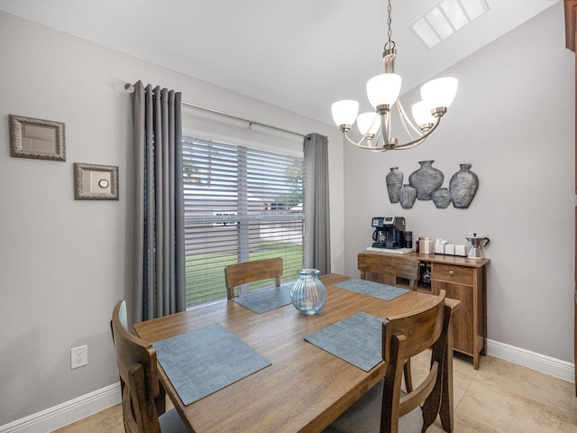 dining room with a notable chandelier