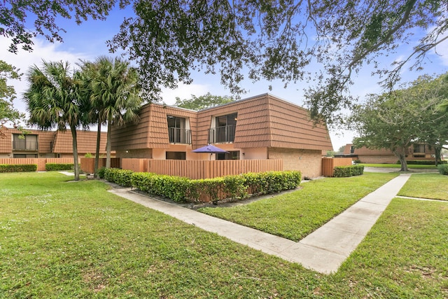 view of side of home with a lawn